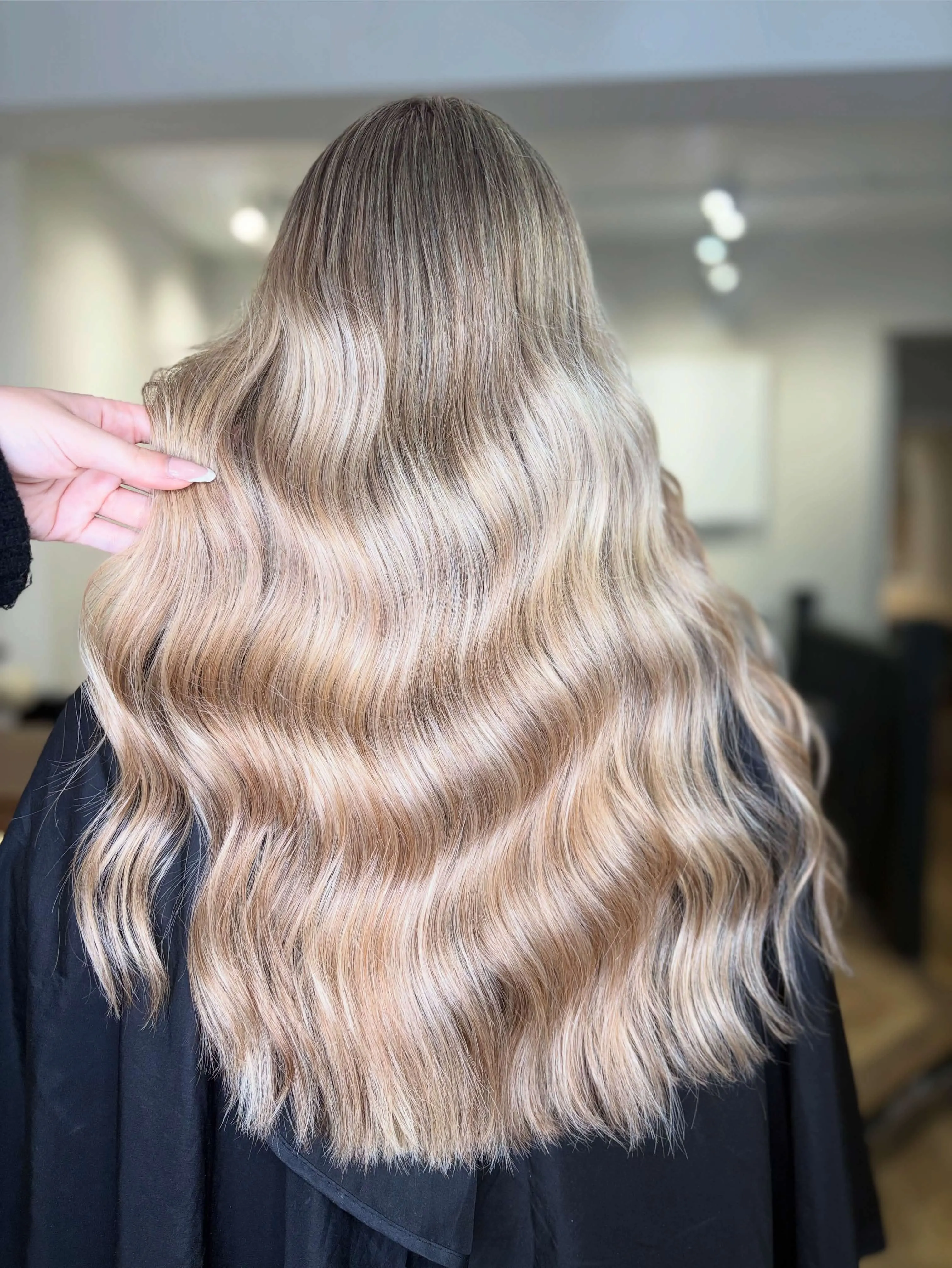 Warm blonde waves — colour and extensions