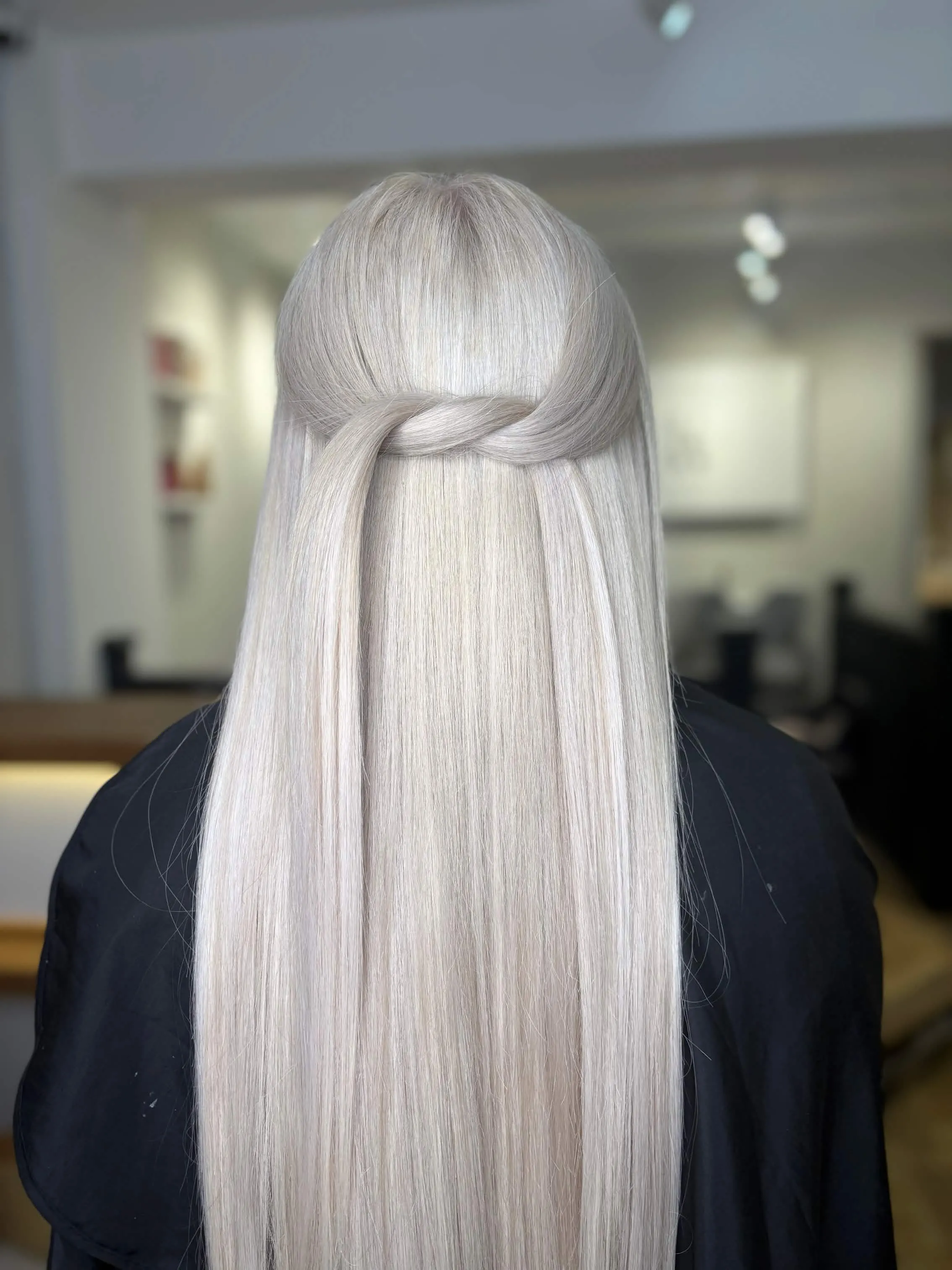Platinum blonde half-up styling by KTB Hairstylist in Eastwood, Nottingham